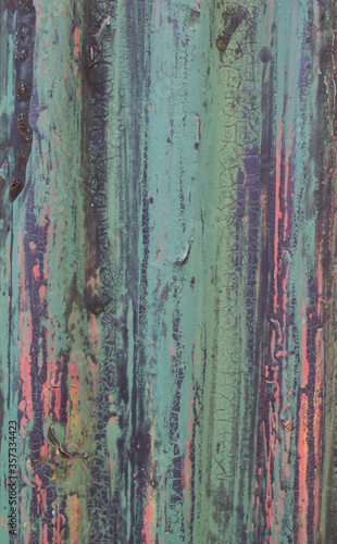 Old weathered corrugated sheet /panel with peeled paint. Background texture of rusty painted corrugated iron cladding