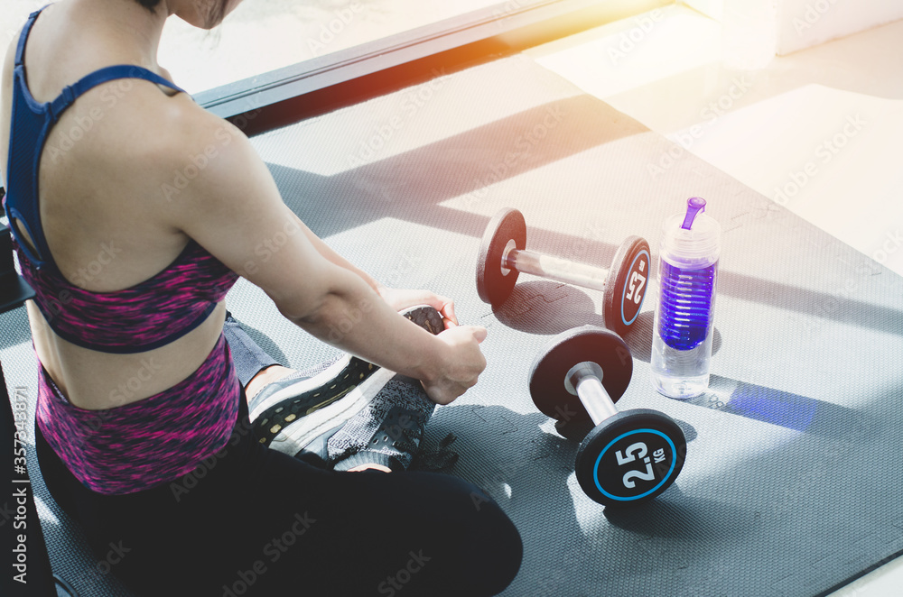 young woman doing fitness exercise in the gym young woman doing fitness exercise in the gym