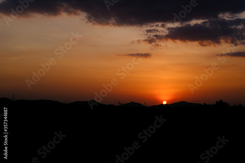 sunset light yellow gold sky evening with mountain