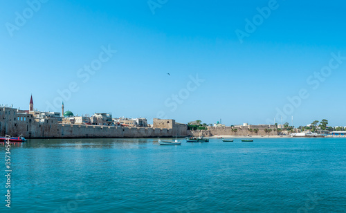 Port of Akko Acre with boats and mosque and the old city in the background, Israel. © DVY714