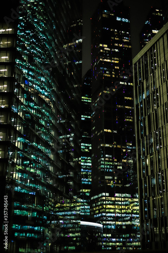 Canvas Print night view of modern urban architecture with burning Windows