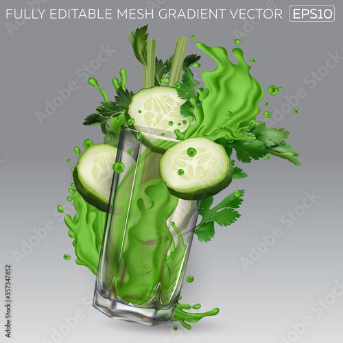 Splash of green juice in a glass, cucumber slices and celery leaves