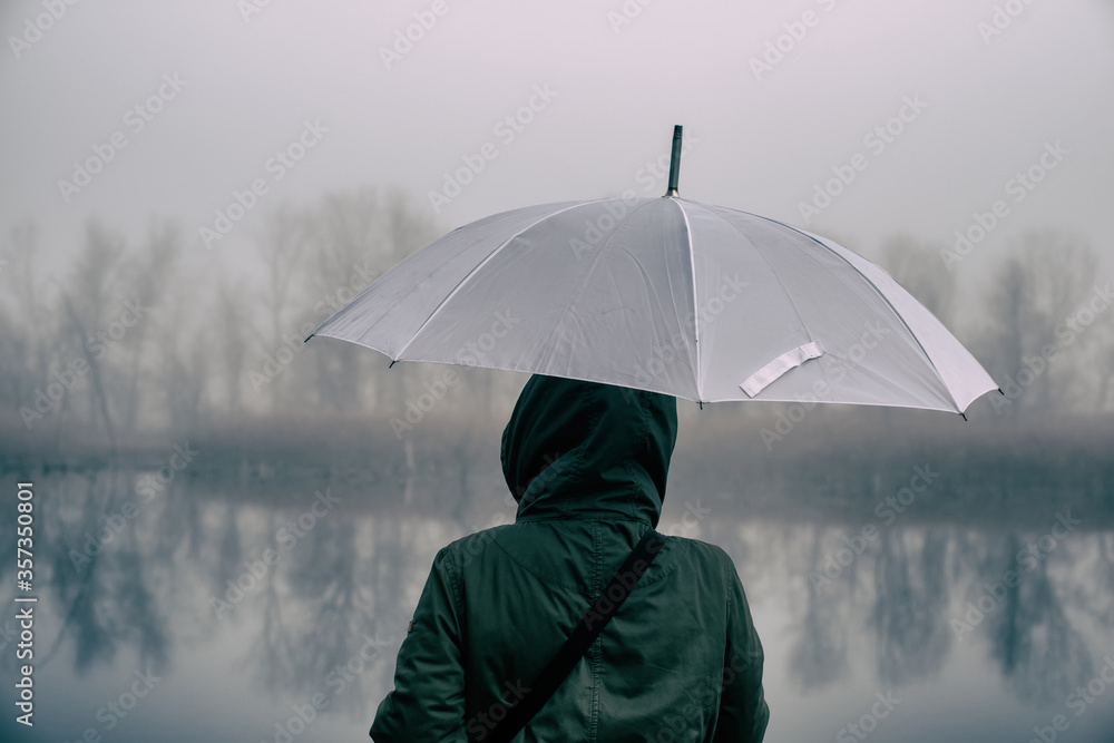 Woman With Umbrella Looks At River And Forest.