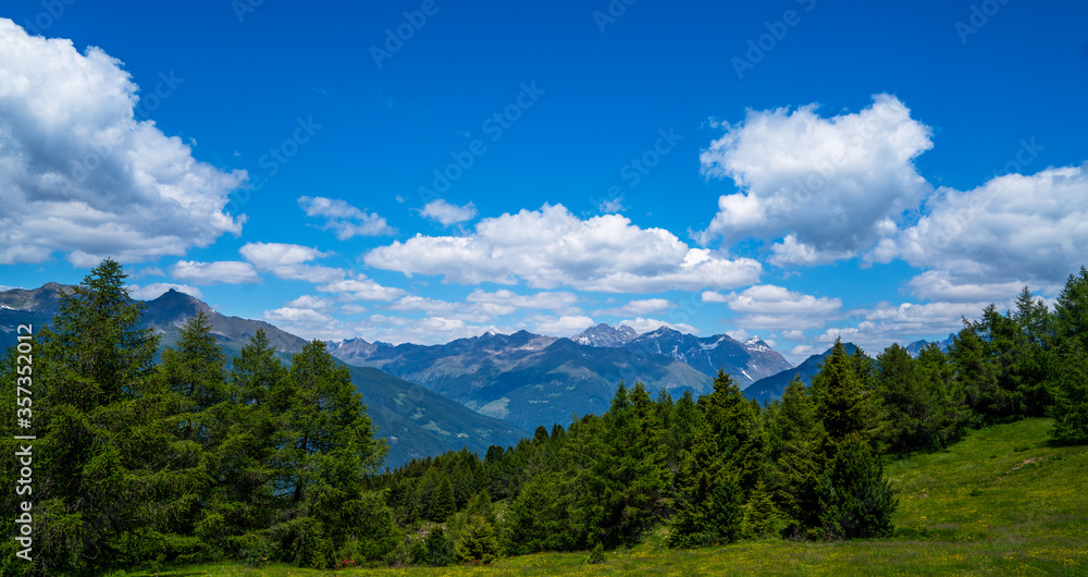 Motorcyclists enjoys the ride. Motorcyclists travels on motorbikes, has adventure trip travel on a mountain road in the Alps. Active rest during summer, drives on high speed.