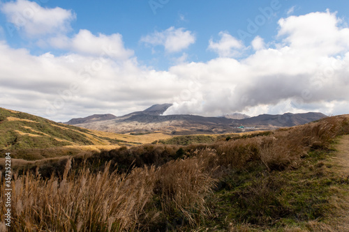 Distant view of Mount Aso volcano releasing steam days before eruption  November 2019 . Kyushu  Japan.