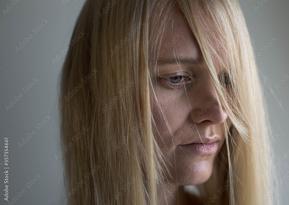 Close up portrait of depressed blond woman Close up portrait of depressed blond woman