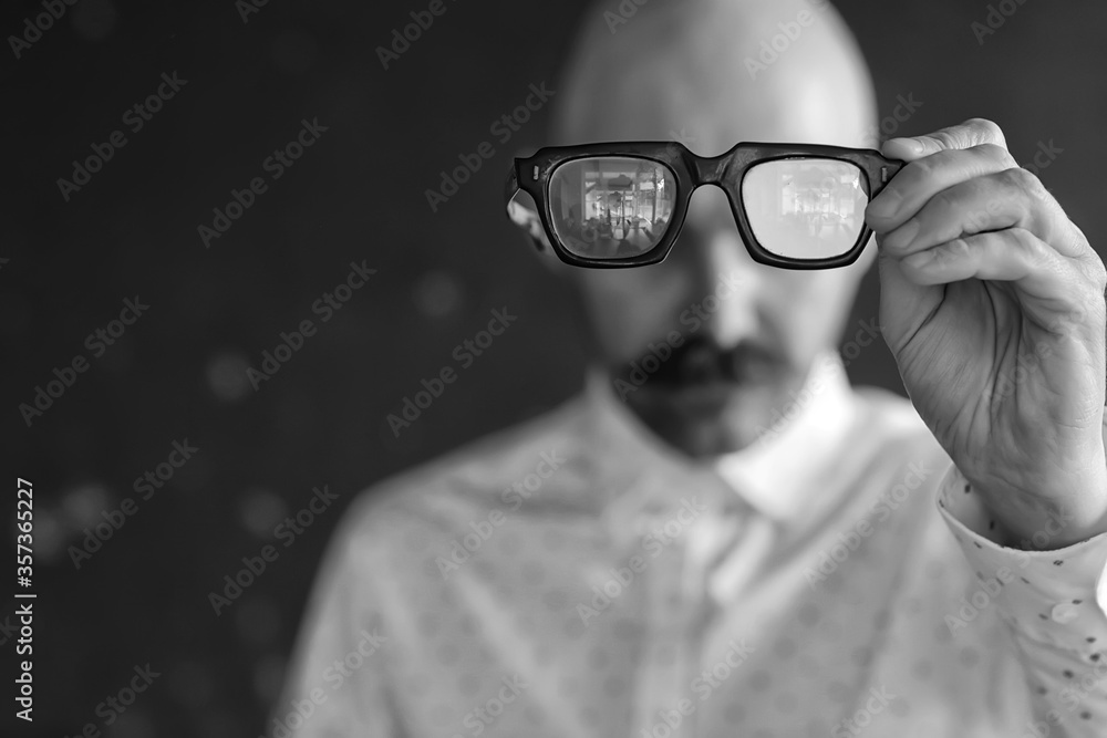glasses vision concept, man holds glasses in his hand. glasses vision concept, man holds glasses in his hand.