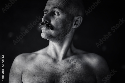sexy macho with a mustache, freak, unusual portrait of a hipster guy