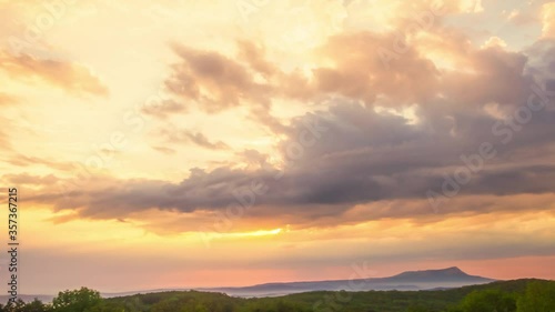 Colorful cloudly sunset at mountains  forest