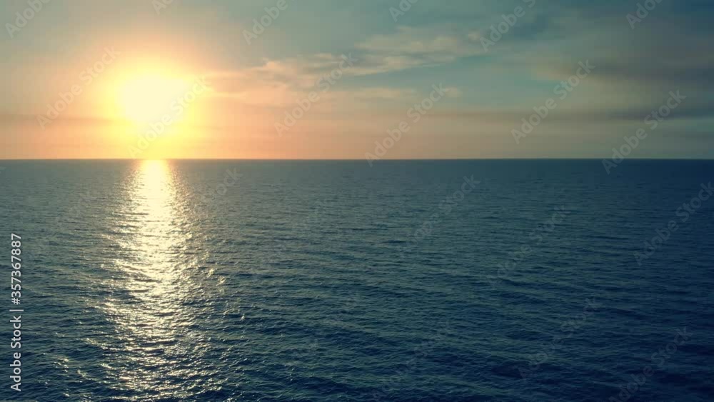 Dron Flying Over Sea in a Beautiful Sunset. Beautiful Sea Sunset Flyover Aerial Drone Shoot. Sunrise Over the Sea. Aerial view of drone slide over sea surface in sun light, golden hour sunset. Dron Flying Over Sea in a Beautiful Sunset. Beautiful Sea Sunset Flyover Aerial Drone Shoot. Sunrise Over the Sea. Aerial view of drone slide over sea surface in sun light, golden hour sunset.