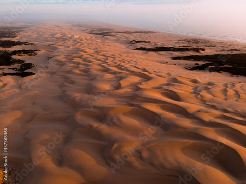 View of pattern on sand dune during sunset