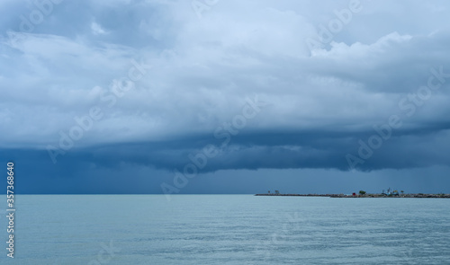 White clouds in the rainy season On the blue sky That gathered above the turquoise sea
