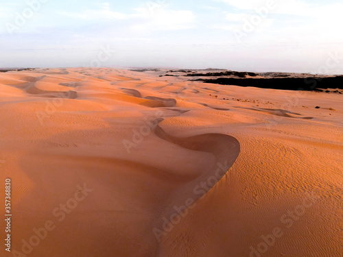 View of sand dunes during sunset