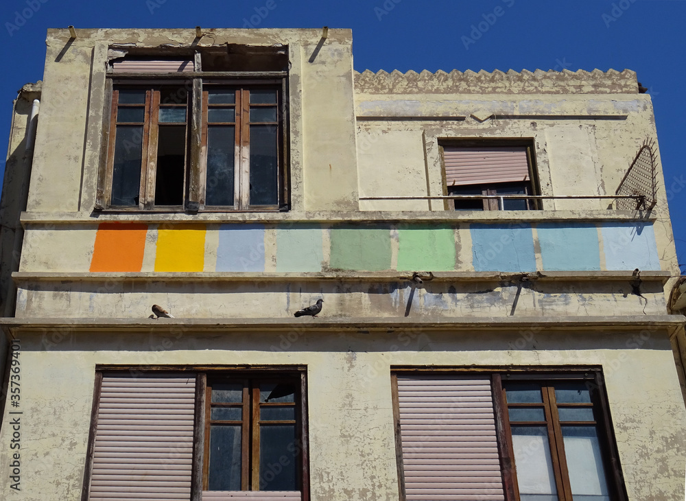 Art deco dilapidated building with colorful facade. Cabanyal Quarter in the city of Valencia. Spain. 