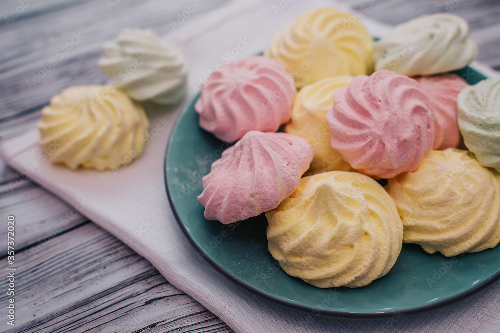 Colorful air marshmallows on a plate. Fresh homemade sweet marshmallows Colorful air marshmallows on a plate. Fresh homemade sweet marshmallows