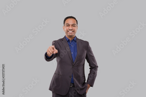 Businessman Pointing Front Watching in Camera Isolated. Indian Business Man Standing