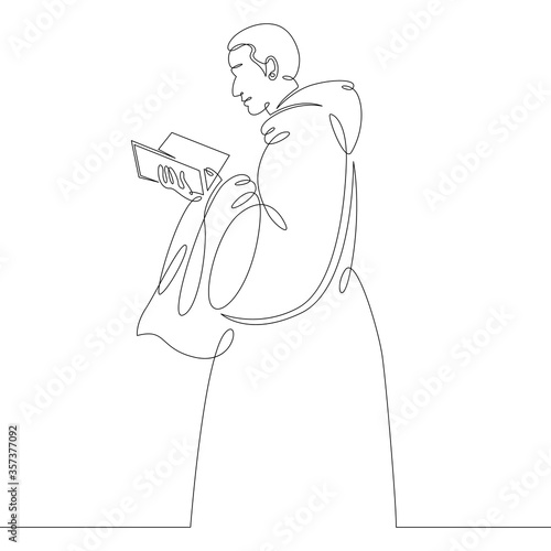 Fotografie, Tablou catholic monk in cassock reads bible