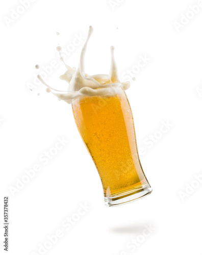 Murais de parede glass of lager beer floating on white background with shadow