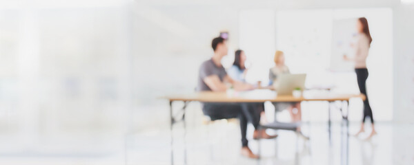 Abstract blurred interior modern office space with business people group working banner background with copy space.