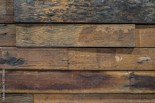 Surface of the old wooden planks used to make the wall