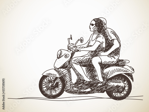 couple riding scooter