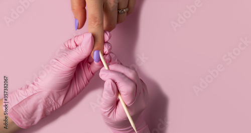 Manicure process on pink background  top view.Manicure in beauty salon.Manicure concept banner