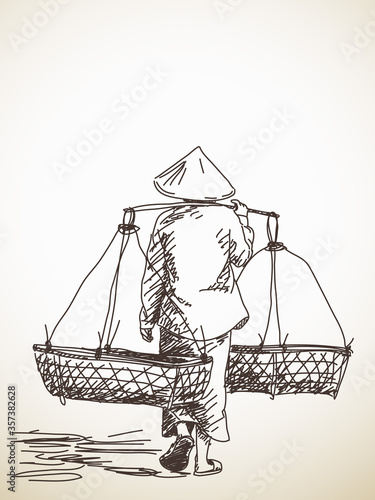 Woman carrying a yoke