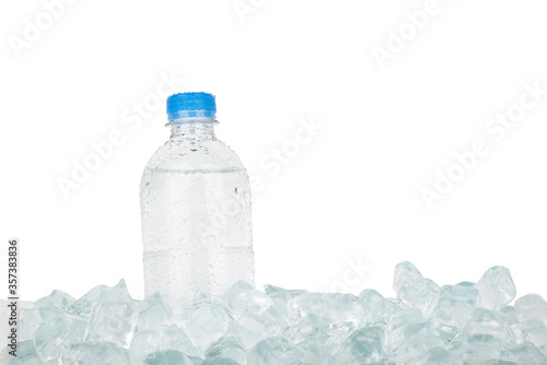Plastic bottle of drinking water on ice over white