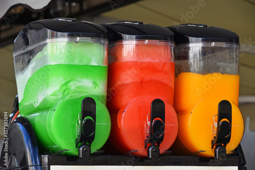 Tableau sur toile Colorful slush ice smoothies in machine