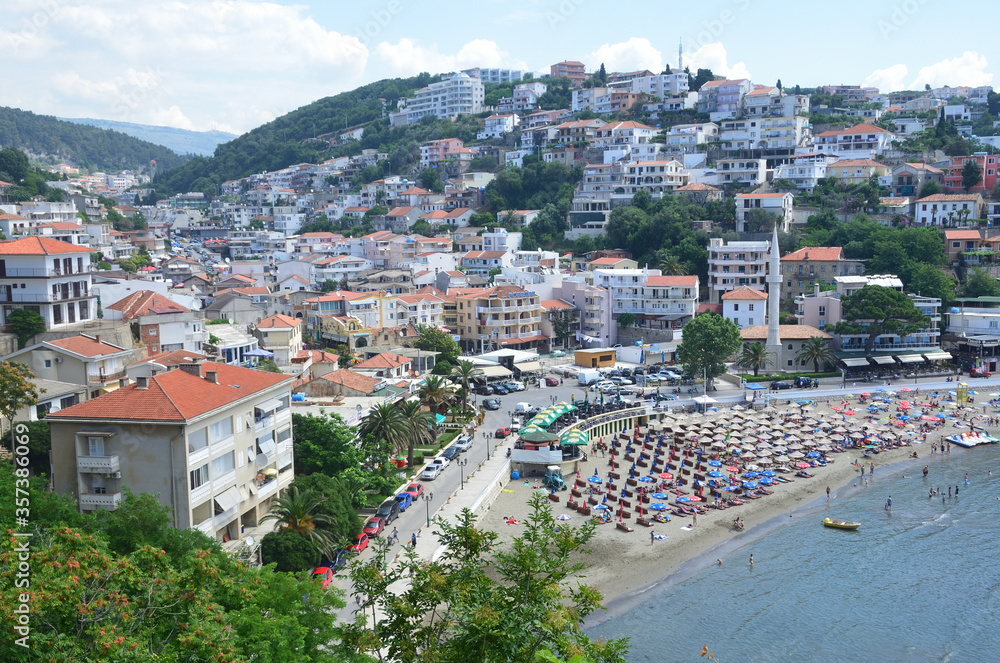 Old city of Ulcinj in summer. Residential areas, mosque and beach. Montenegro