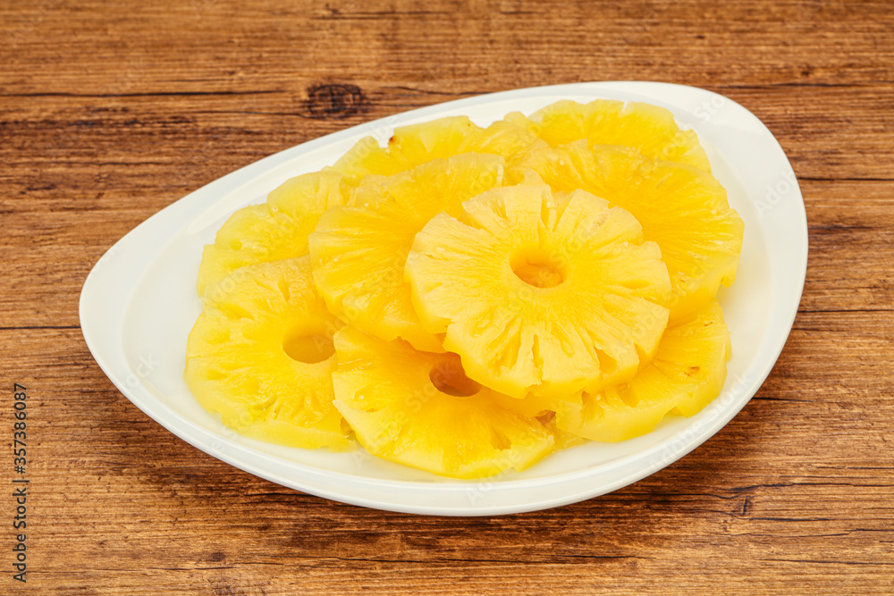 Marinated pineapple rings in the bowl Marinated pineapple rings in the bowl