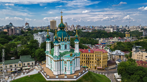 Aerial drone view of Saint Andrew's church and Andreevska street from above, cityscape of Podol district, city of Kiev (Kyiv), Ukraine 