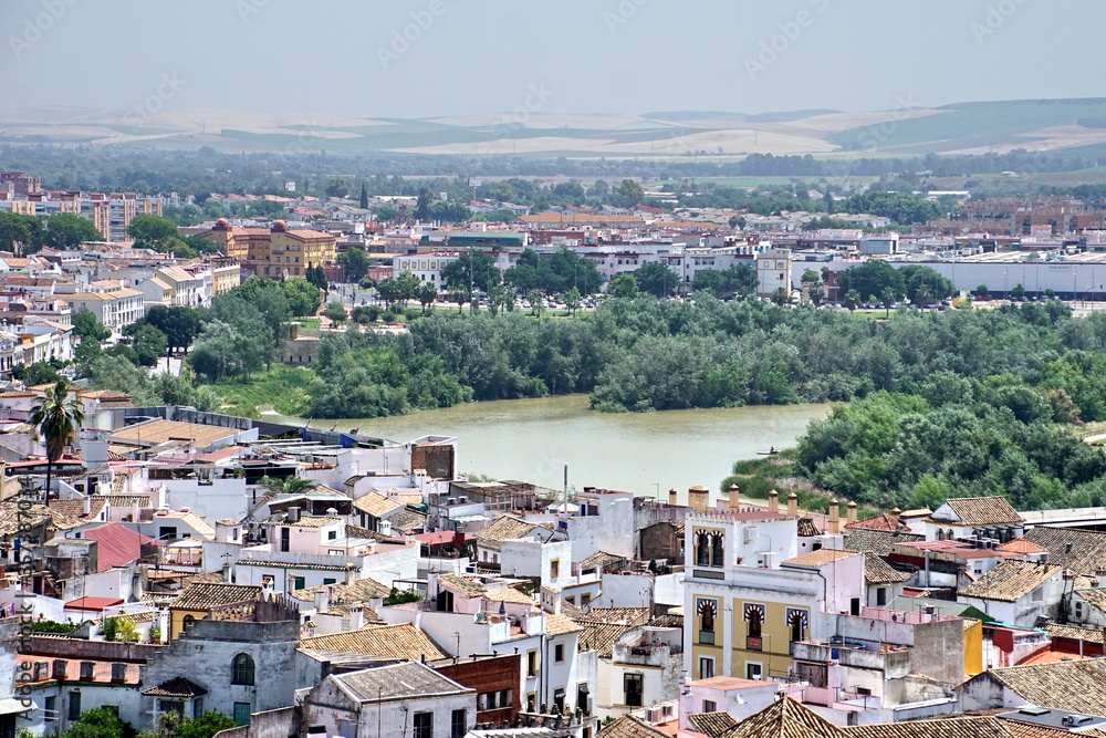 Bright morning over historical cityscape of Cordoba with houses and tile roofs, Spain.