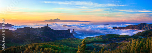 Grand Canary island. Mirador Roque Nublo . Breathtaking  mountains over sunset and view of Tenerife . photo
