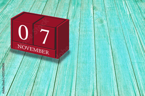 Wallpaper Mural November 7th, Day 07 of November month, Red calendar on workplace green wood, Empty space for text, Copy space right, 3D illustration Torontodigital.ca