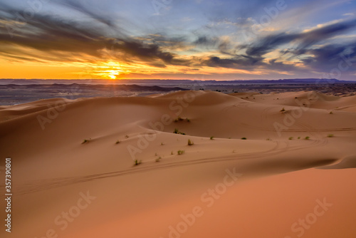 Dramatic and colorful sunset at The Sahara desert: Earth's Largest Hot Desert