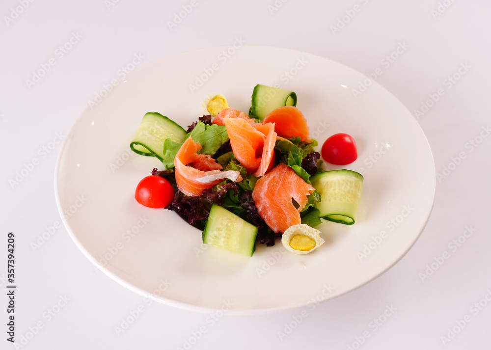 Salmon Salad with Truffle Ponzu. Vegetable salad with red fish. White background
