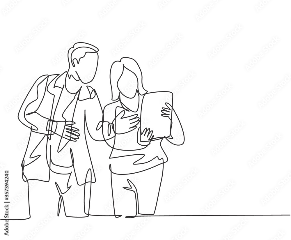 One continuous line drawing of young startup members check the work each others using laptop and tablet. Business process teamwork concept. Single line draw design vector illustration