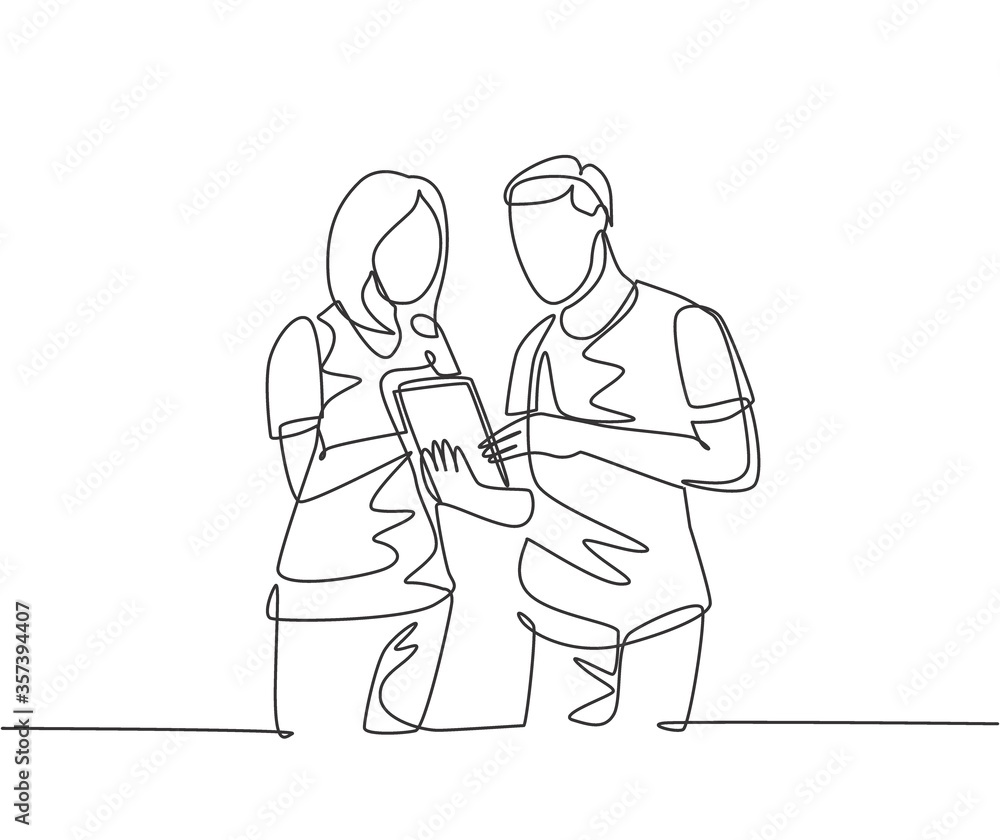 One continuous line drawing of young male and female employee talking about company target while staring tablet screen. Business goal discussion concept single line draw design vector illustration