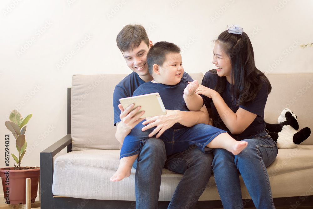 Happy family are enjoying on sofa at home, Safety home activity concept