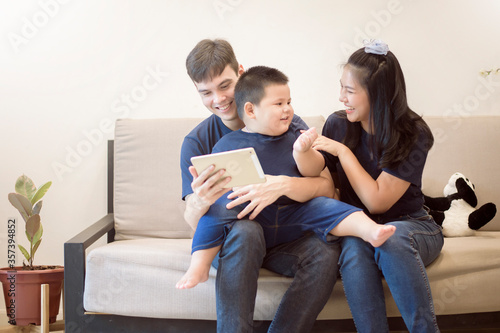 Happy family are enjoying on sofa at home, Safety home activity concept
