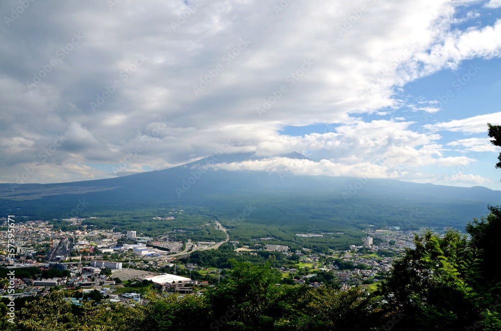 View towards cloud covered mount Fuji over Kawaguchi town, Japan