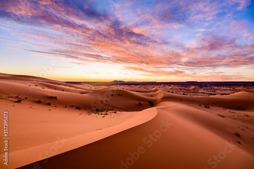 Dramtic and colorful sunrise at the Sahara desert: Earth's Largest Hot Desert
