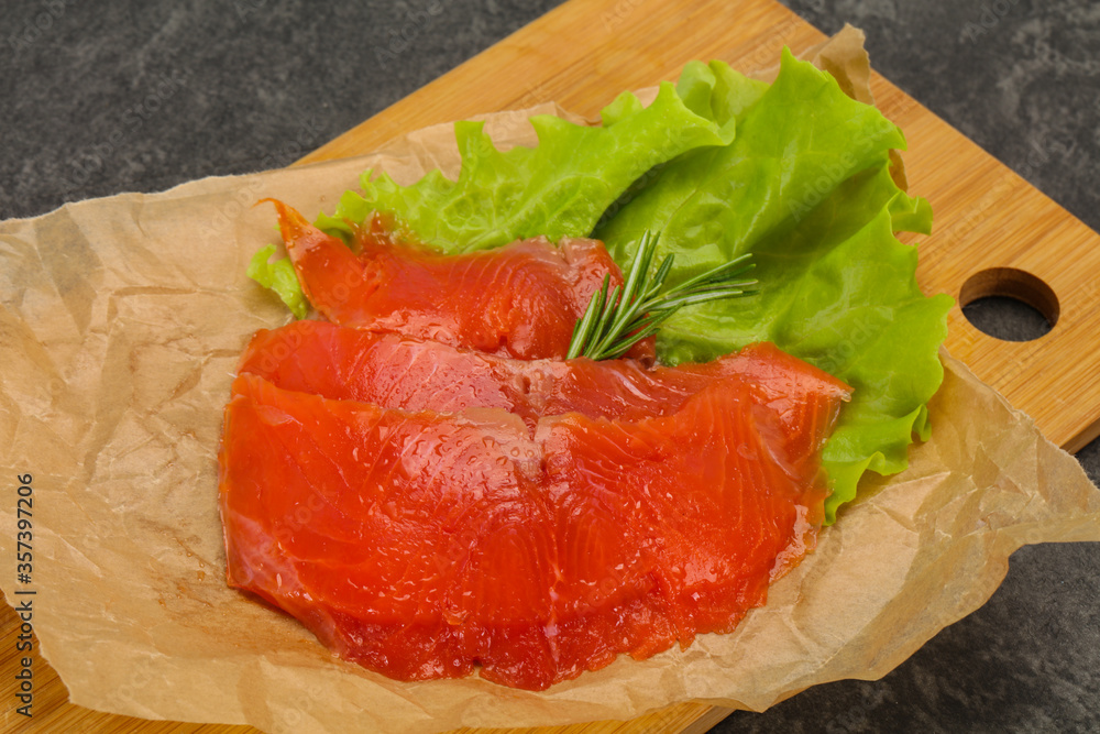 Sliced salmon fillet served rosemary Sliced salmon fillet served rosemary
