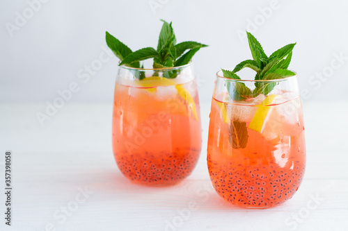 Trendy summer basil seeds iced drinks with citrus and mint