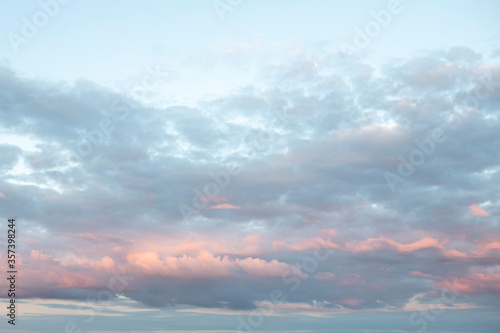 Fototapeta Naklejka Na Ścianę i Meble -  Beautiful dramatic colorful clouds on a blue sky at sunset