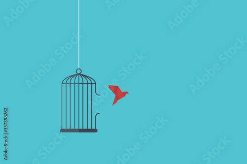 Flying bird and cage. Freedom concept. Emotion of freedom and happiness. Minimalist style.  photo