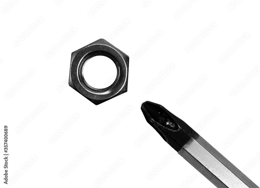 nut and screwdriver on a white background photo with meaning nut and screwdriver on a white background photo with meaning