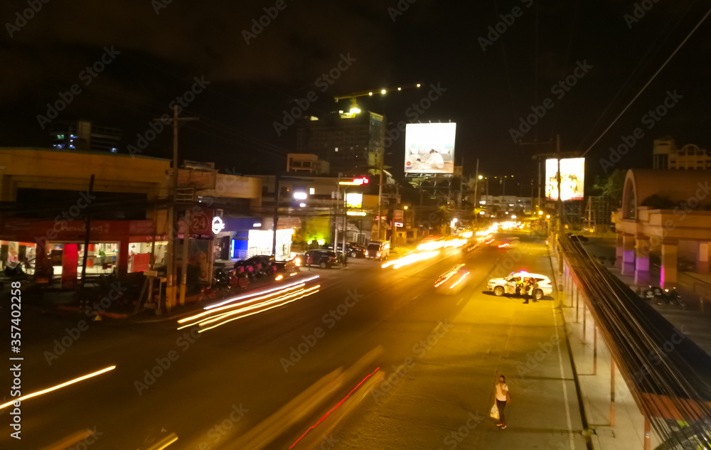 City street at night in motion blur lights.