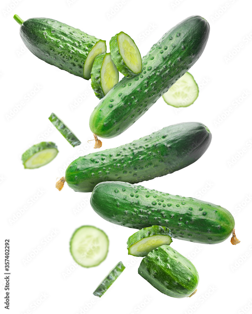 Falling fresh green cucumbers on white background Falling fresh green cucumbers on white background